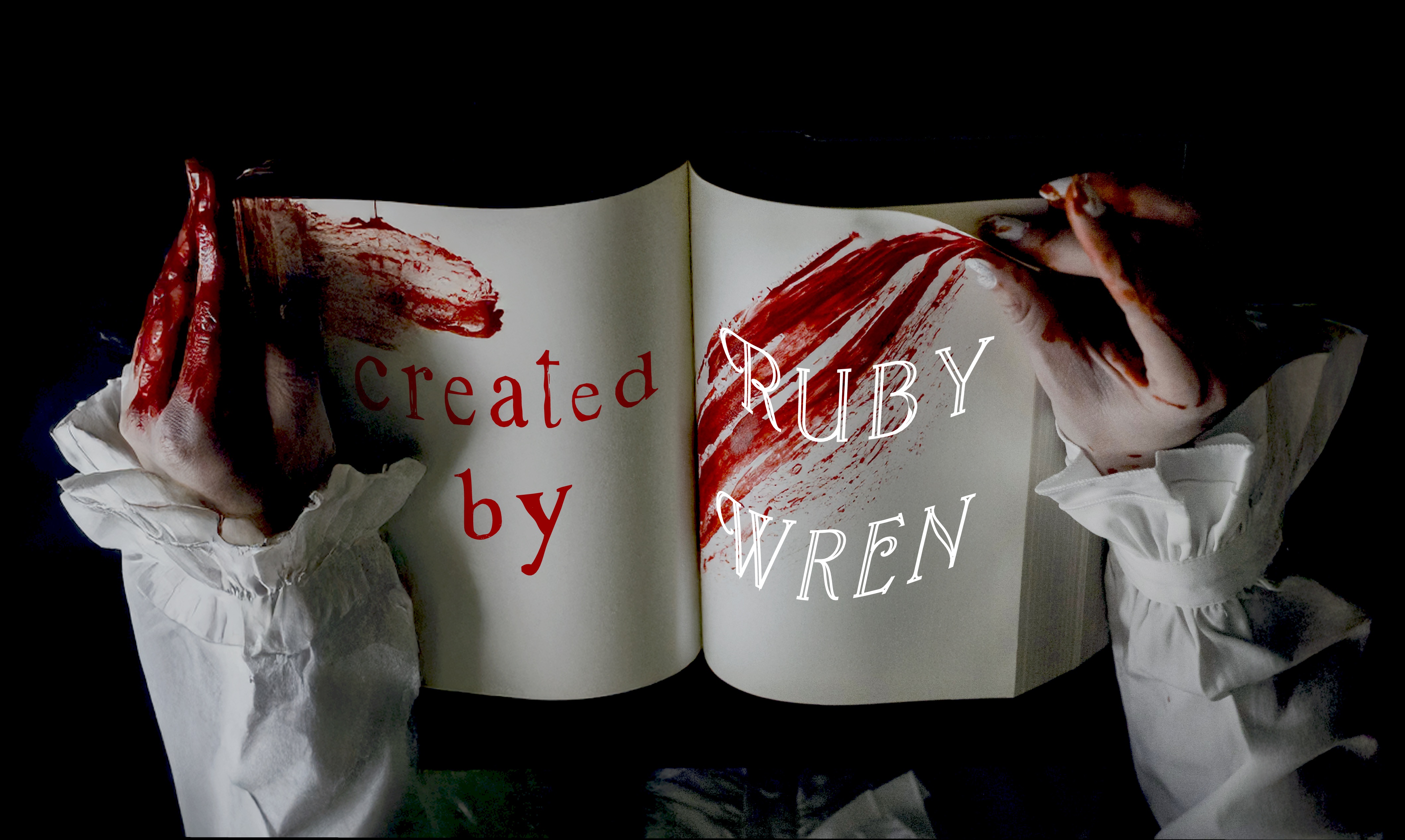 A book with blood on it with a hand on each side holding the book, and the words Created By Ruby Wren.