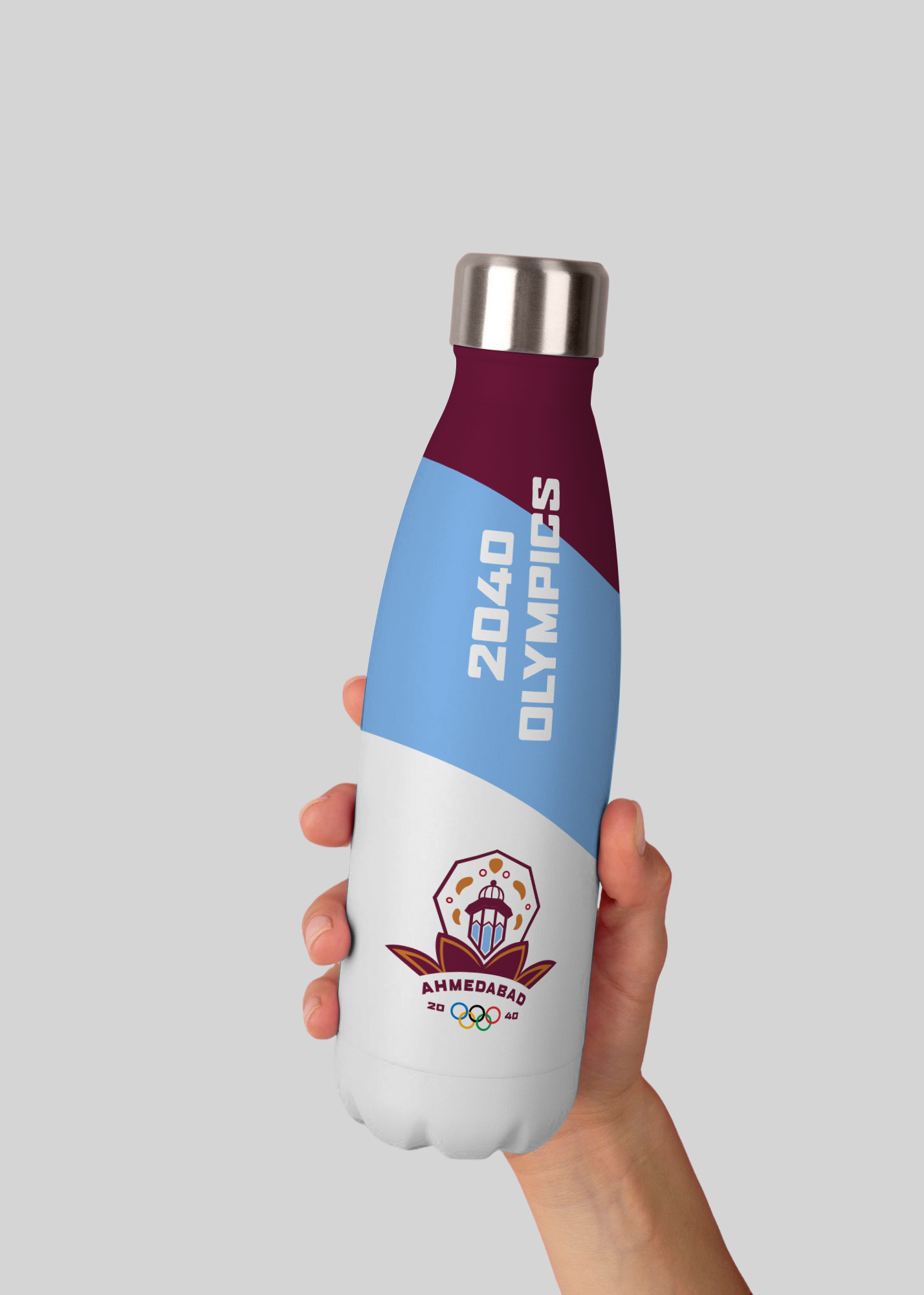 Mockup of a water bottle with white, blue, and red stripes with the words 2040 Olympics and the India Olympics Logo on it